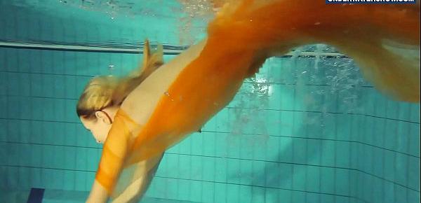  Yellow and Red clothed teen underwater